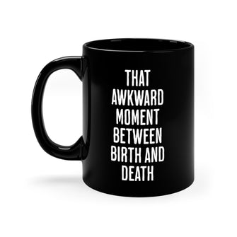 Graphix Fuse "That Awkward Moment Between Birth And Death" Black Mug 11oz